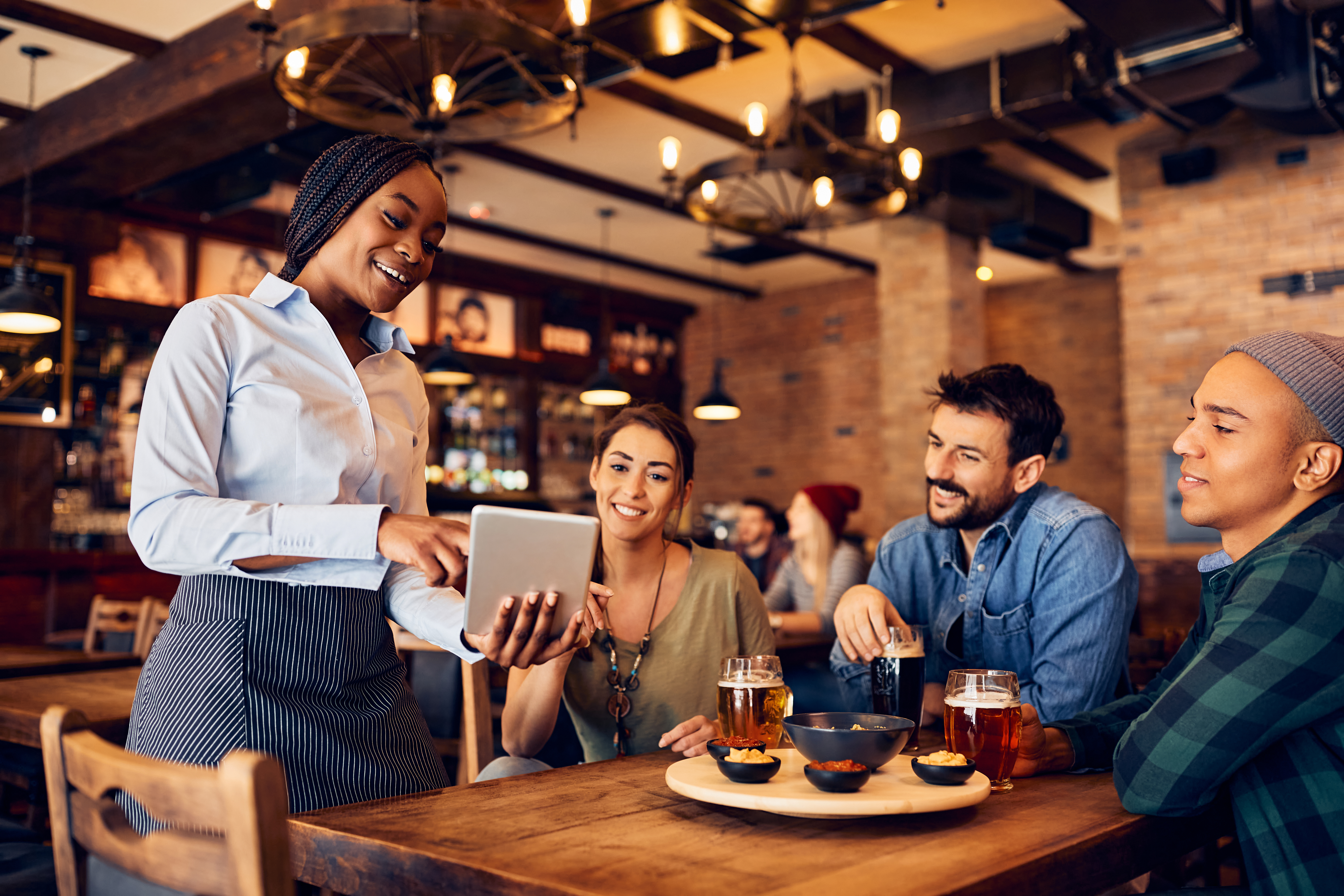Guests checking out happily in a modern restaurant
